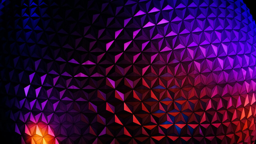 Close up of Epcot Globe with colorful gradient lighting on geometric triangular panels wallpaper
