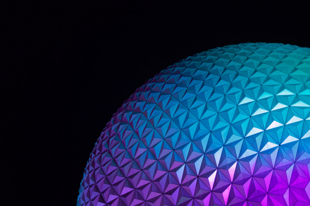Epcot Globe wallpaper with blue purple pink glow geometric texture futuristic design background