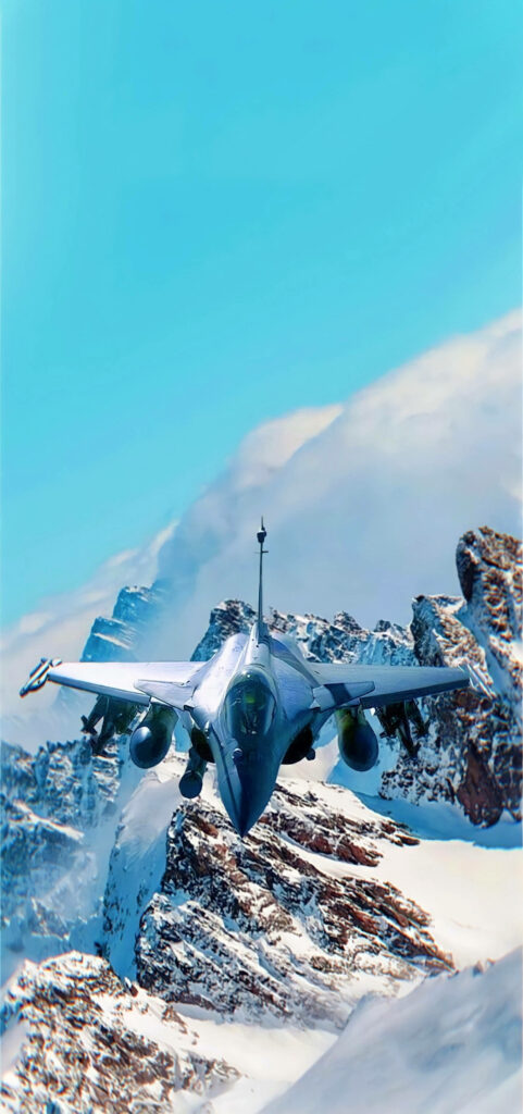 Graceful Grey Jet Soaring Above Majestic Snow-Capped Mountains: An Enchanting Iphone Wallpaper