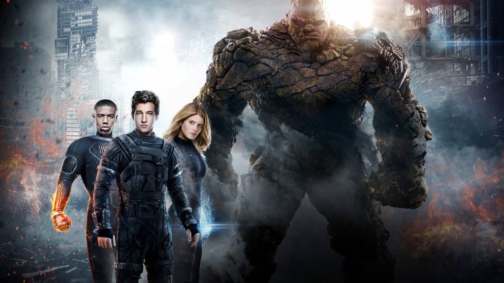 Fantastic Four 2015 team in dark tactical suits with glowing powers in smoky cityscape wallpaper