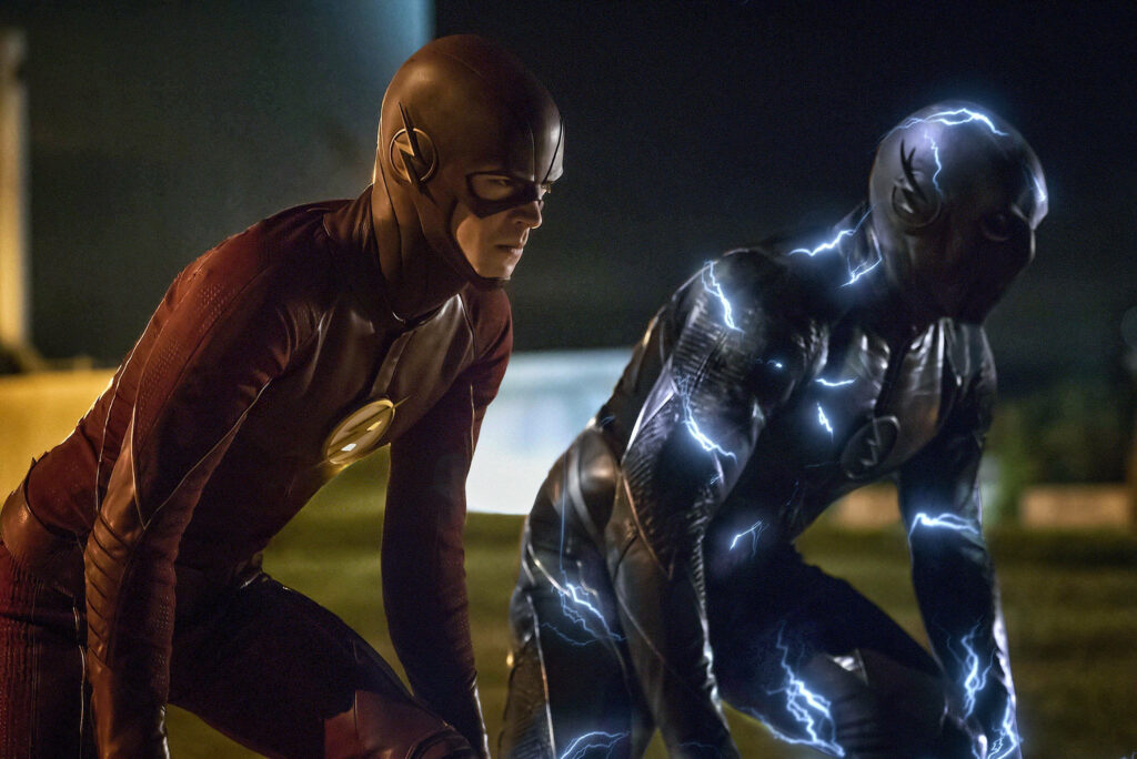 Epic Flash vs. Zoom Wallpaper: Iconic Costumes in Dramatic Night Scene
