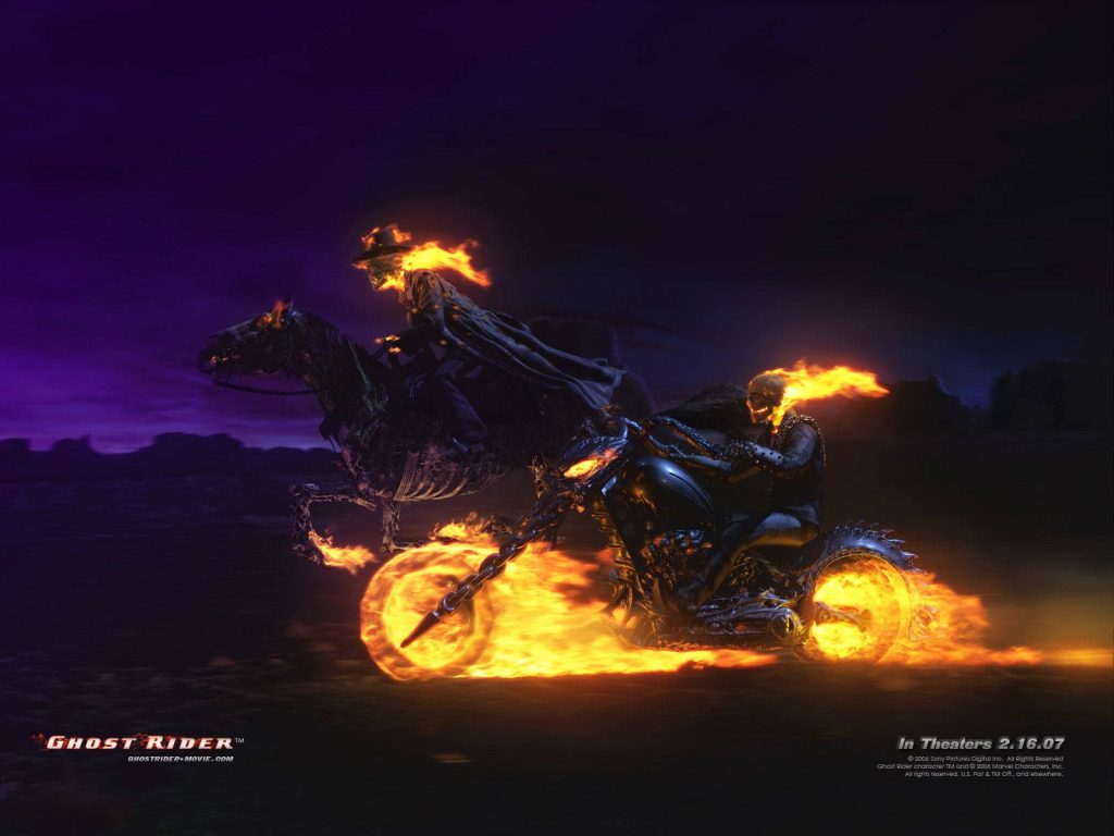 Ghost Rider and Phantom Rider blazing through dark purple wasteland on flaming bikes wallpaper