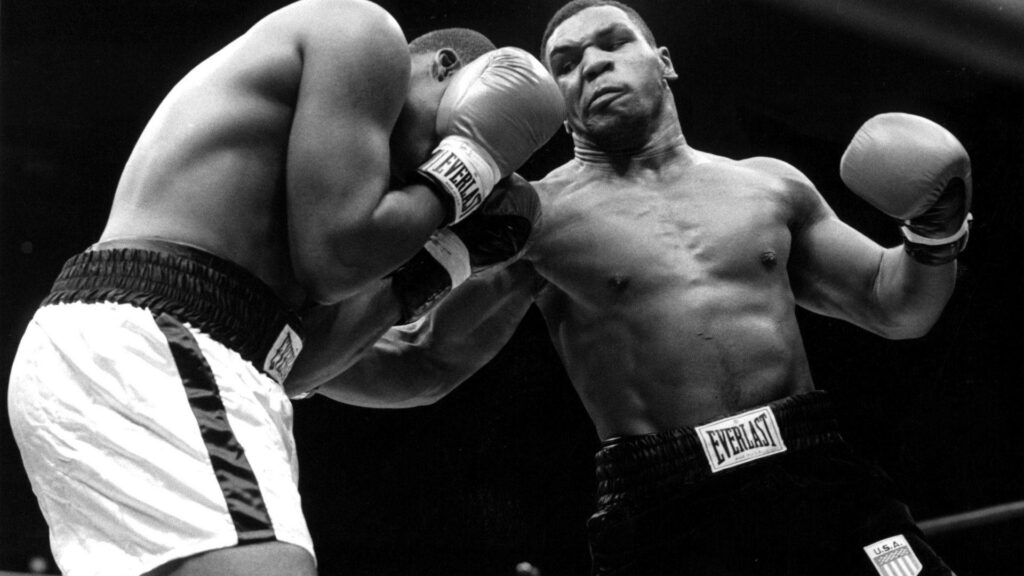 Mike Tyson Wallpaper: Legendary Boxer Delivering a Powerful Punch
