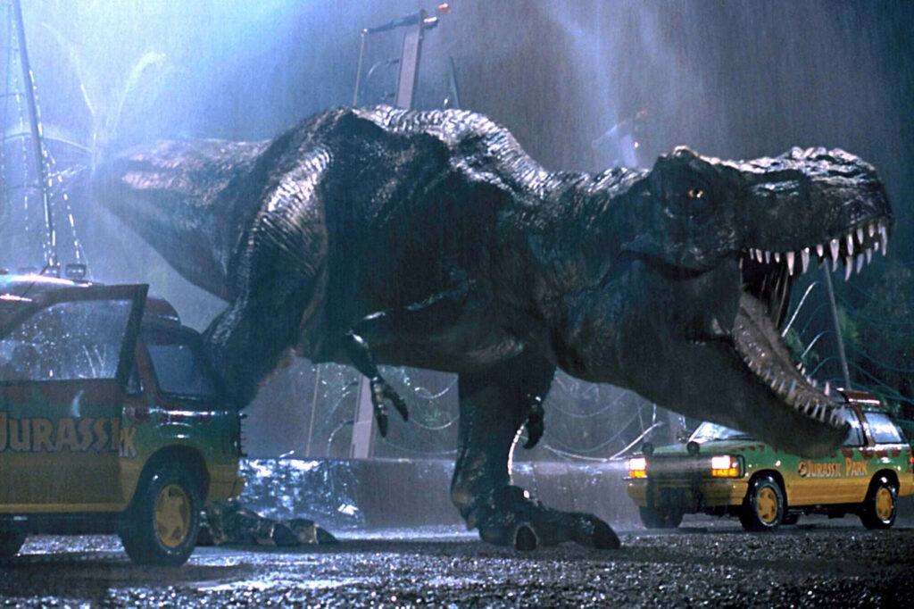 T-Rex Breakout Wallpaper: Iconic Jurassic Park Scene in Dramatic Setting