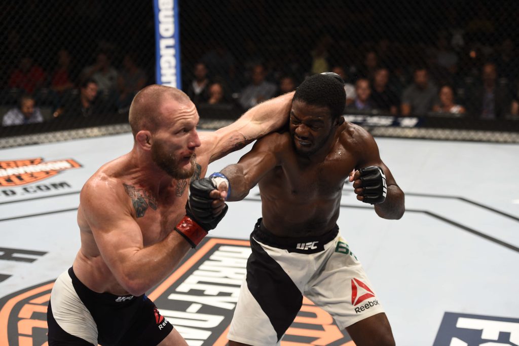 Gray Maynard and Ryan Hall fierce UFC octagon fight intense MMA action wallpaper background