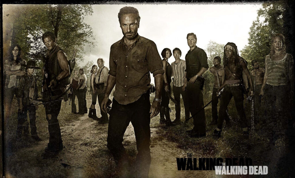 Epic Walking Dead Heroes Wallpaper with Dramatic Fiery Background