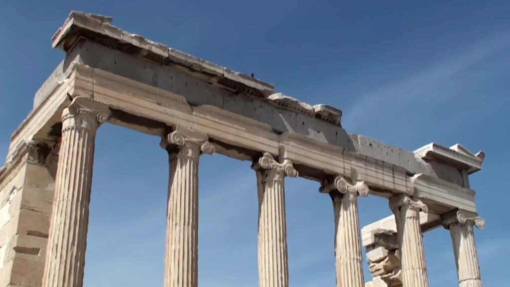 Erechtheion tall columns against clear blue sky ancient Athens architectural wallpaper background