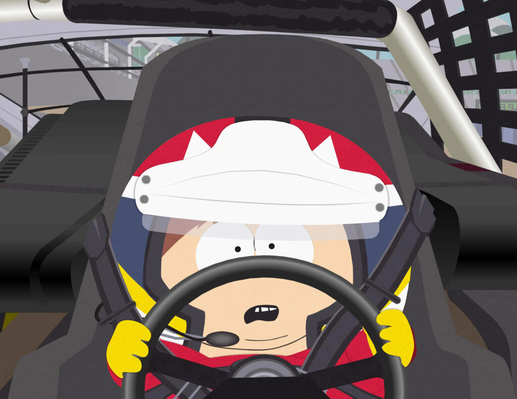 Eric Cartman in NASCAR racing suit gripping steering wheel focused on race track South Park wallpaper