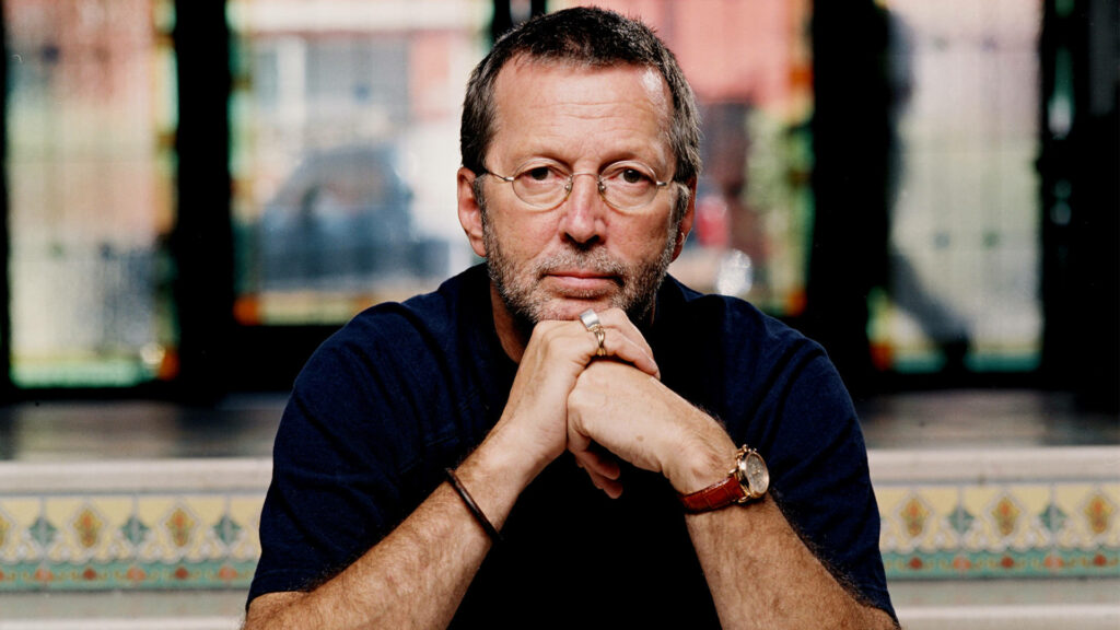 Eric Clapton portrait wallpaper vibrant detailed background contemplative expression and style