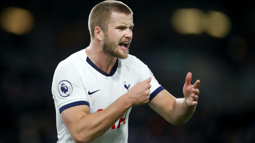 Eric Dier shouting passionately in Tottenham Hotspur white kit during intense football match action Wallpaper
