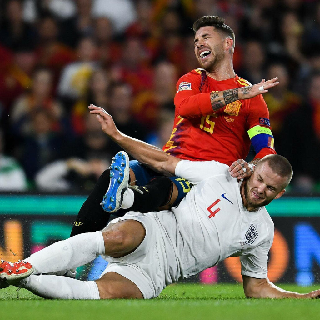 England's Eric Dier tackles Spain's Sergio Ramos in intense UEFA Nations League match wallpaper