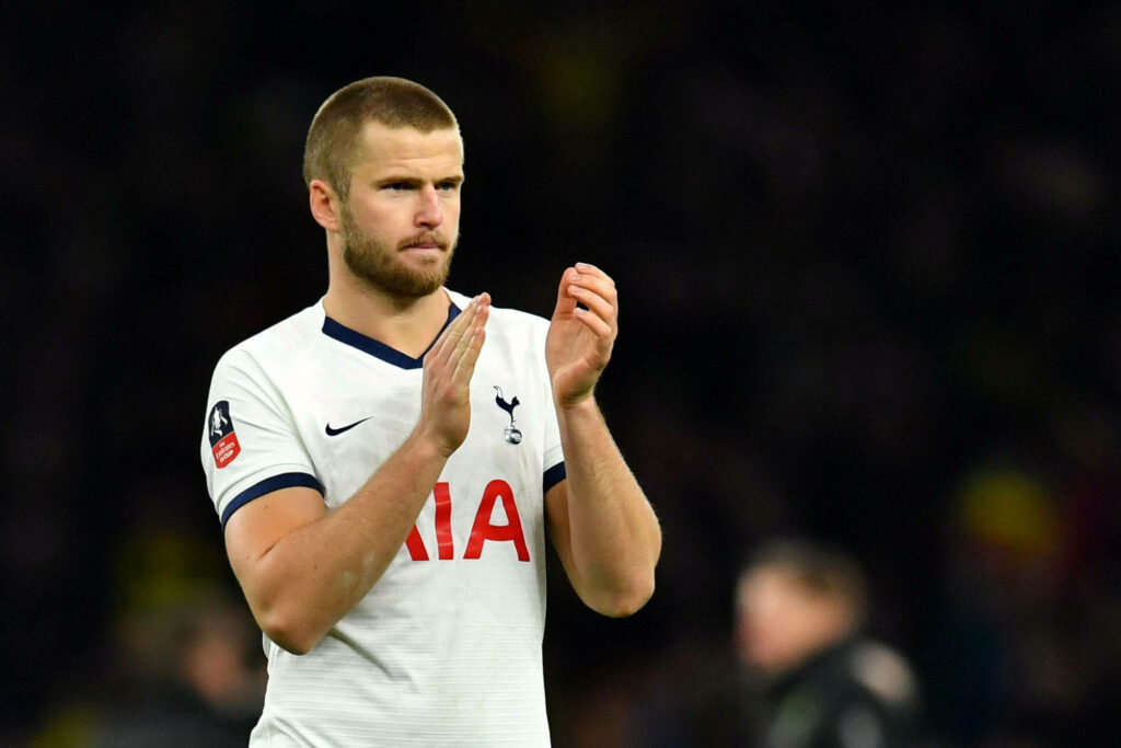 Eric Dier in white Tottenham Hotspur jersey clapping hands showing sportsmanship on stadium background Wallpaper
