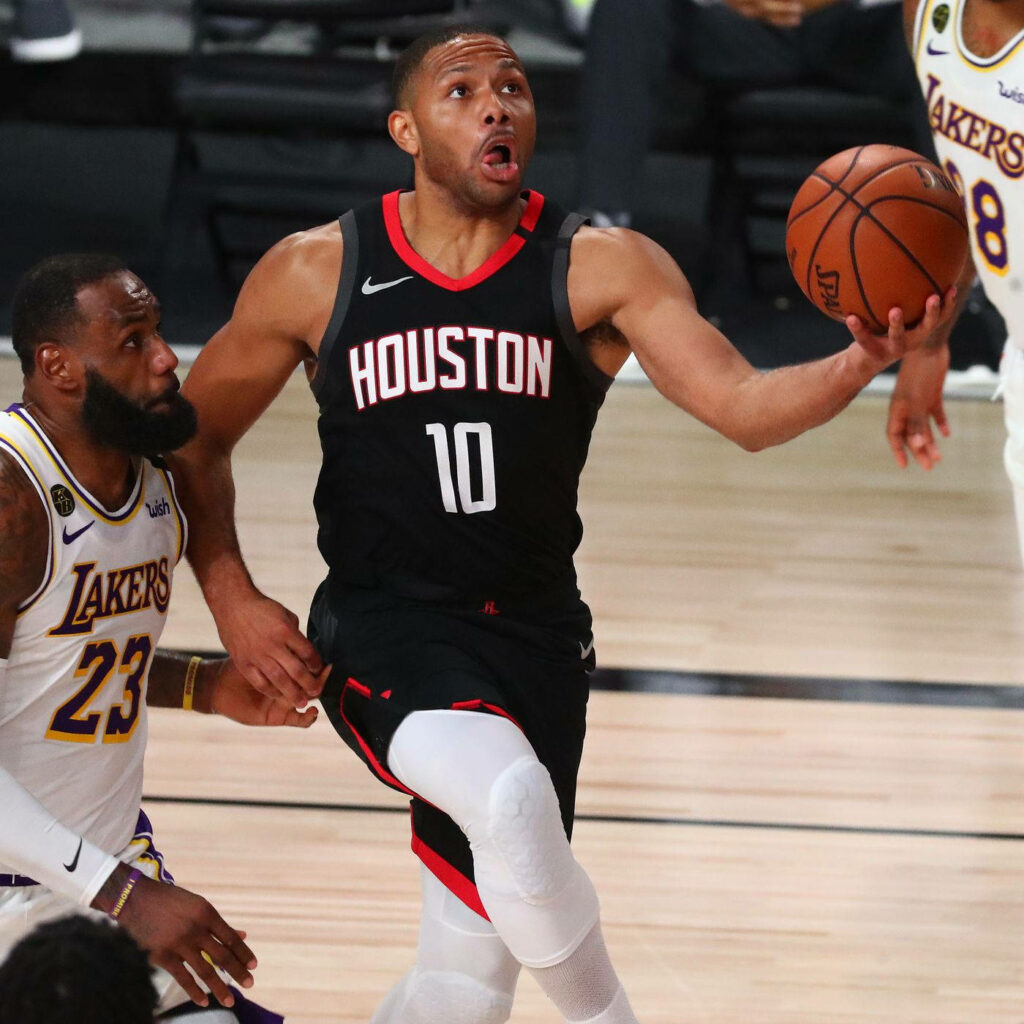 Eric Gordon driving to the basket defended by LeBron James Lakers intense NBA action wallpaper