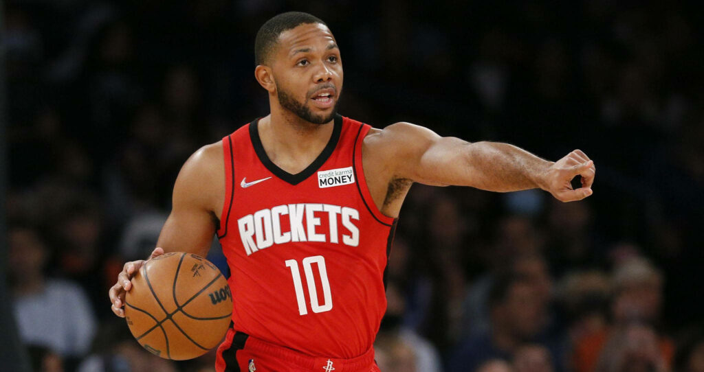 Houston Rockets Eric Gordon dribbling basketball focused in red jersey dynamic sports wallpaper