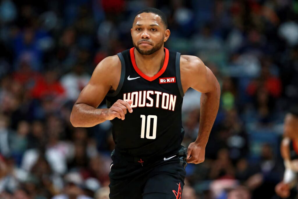 Eric Gordon Houston Rockets basketball player mid-stride intense focus dynamic game action wallpaper