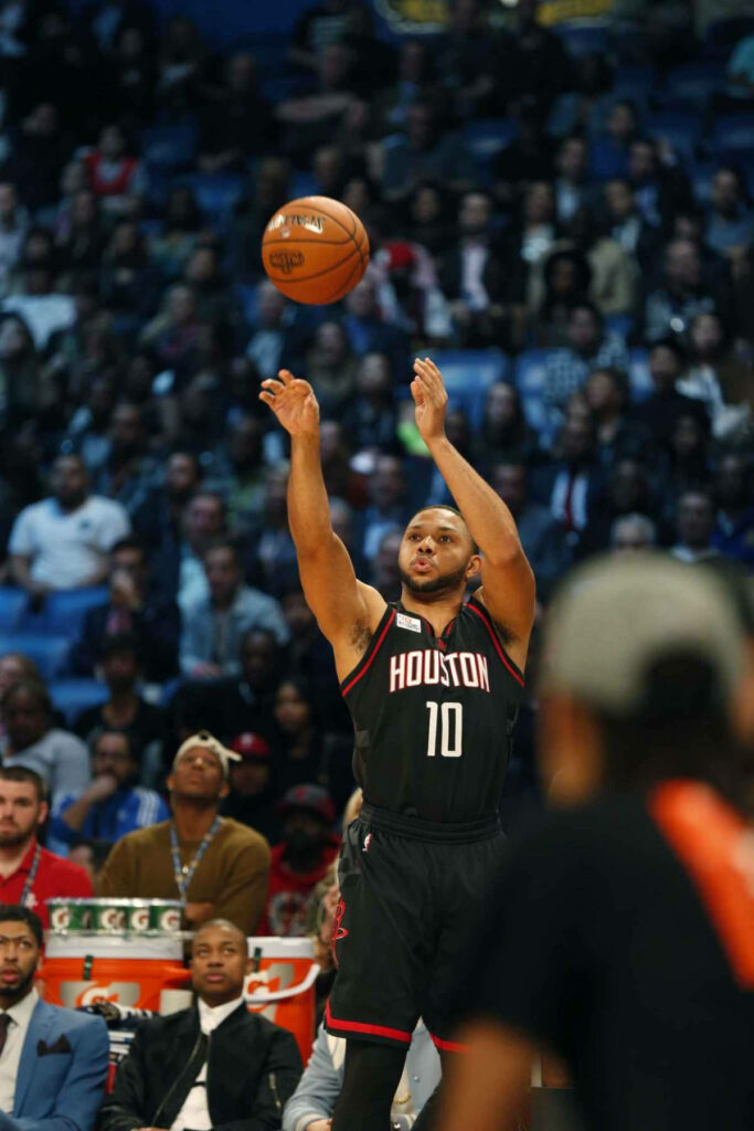 Eric Gordon Houston Rockets mid-air 3-point shot black jersey basketball action wallpaper