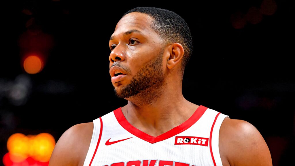 Close-up of Eric Gordon in Houston Rockets jersey showing focused intense expression and athletic build Wallpaper