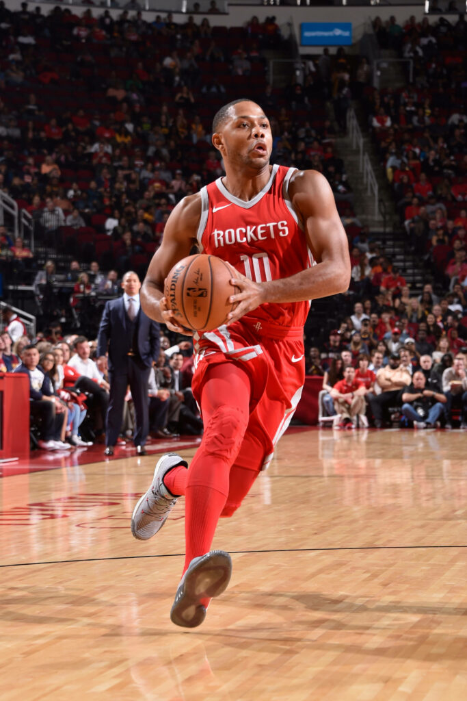 Eric Gordon Houston Rockets dribbling basketball in action on court during intense NBA game Wallpaper