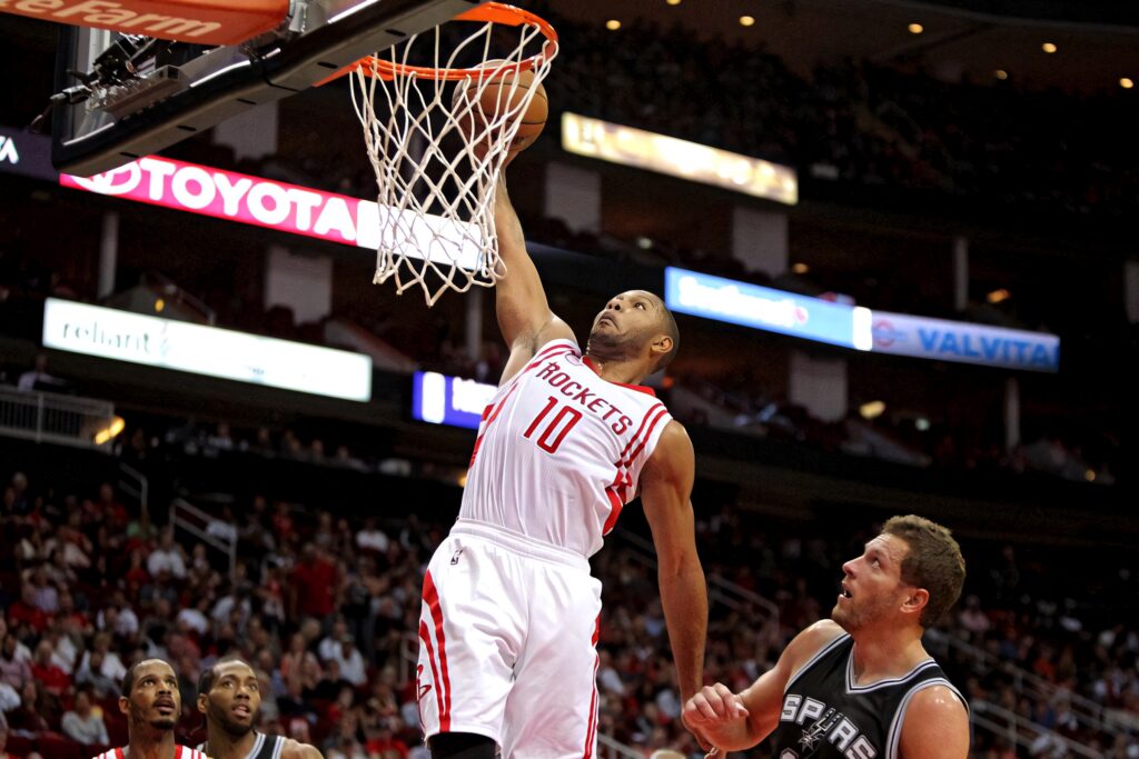 Eric Gordon Houston Rockets dunk over Omri Casspi San Antonio Spurs vibrant basketball action Wallpaper