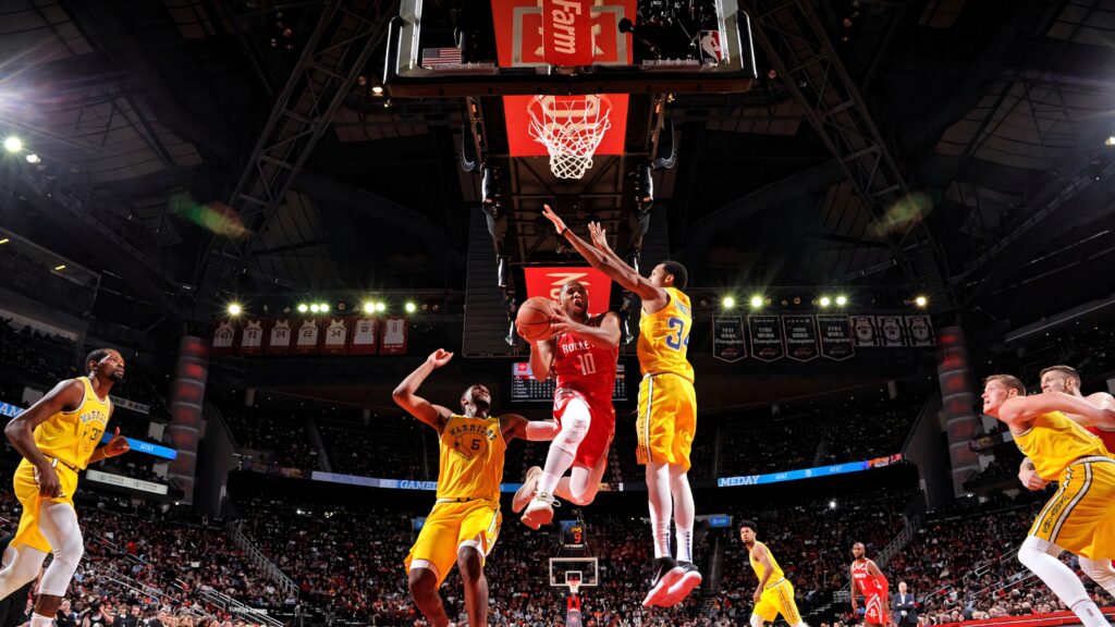 Eric Gordon Houston Rockets number 10 driving for layup against Golden State Warriors defenders Wallpaper