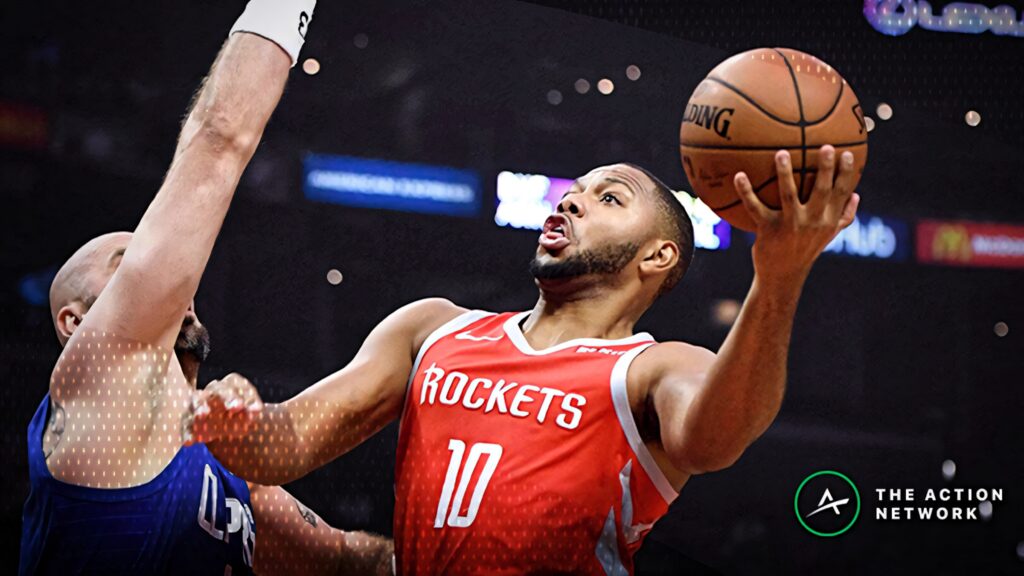 Eric Gordon mid-air layup Houston Rockets red jersey basketball action intense dynamic wallpaper