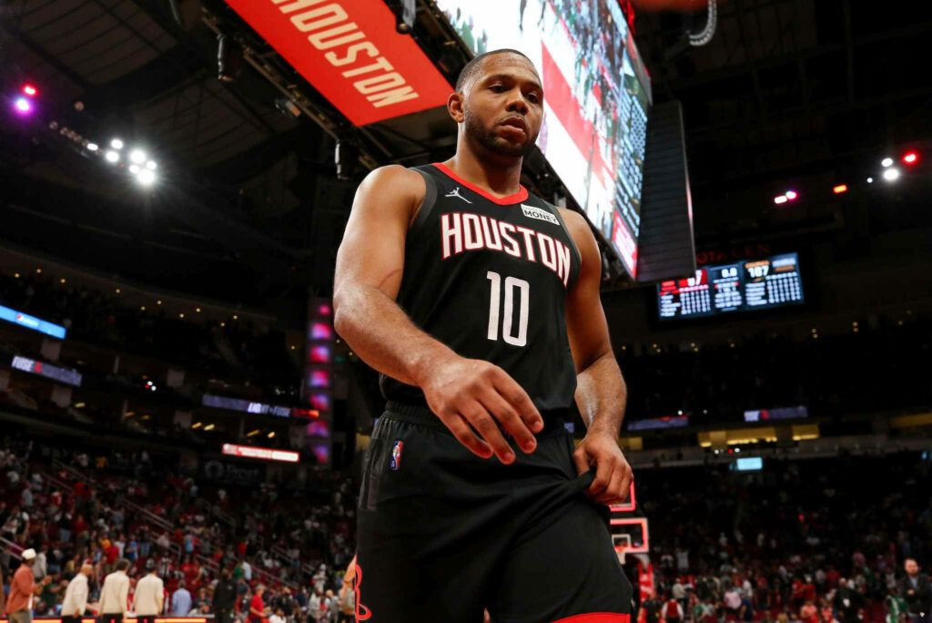 Eric Gordon Houston Rockets low-angle basketball shot vibrant arena lights intense focus wallpaper