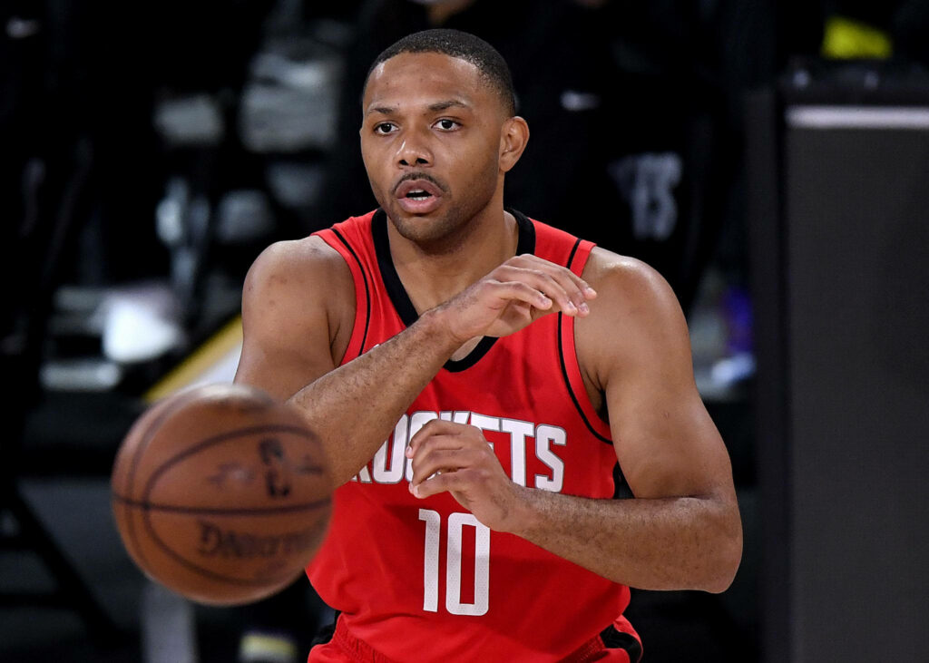 Eric Gordon Houston Rockets passing basketball in action intense game focus athleticism wallpaper
