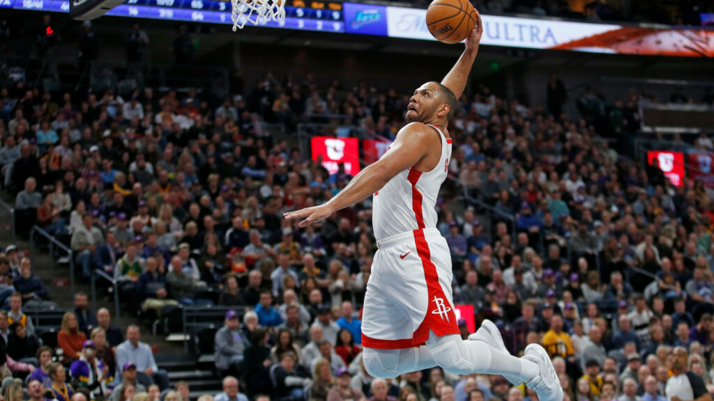 Eric Gordon mid-air slam dunk Houston Rockets intense focus basketball action arena crowd Wallpaper