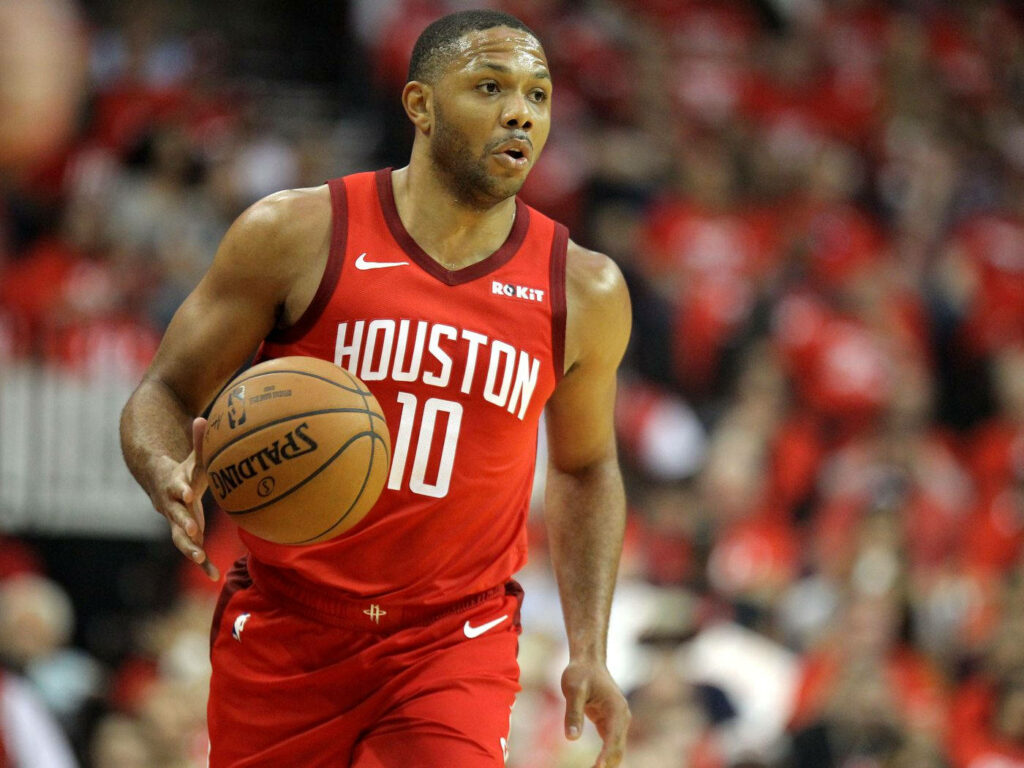 Houston Rockets Eric Gordon dribbling basketball on court with vivid red colors and blurred fans Wallpaper