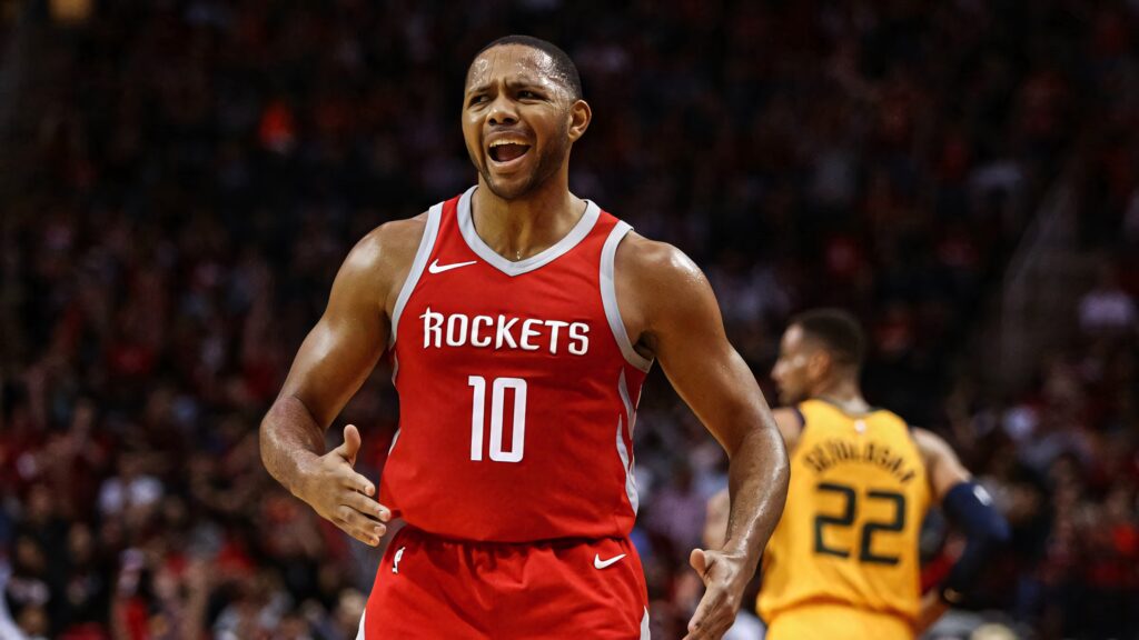 Eric Gordon in red Rockets jersey intense expression dynamic basketball game vibrant wallpaper