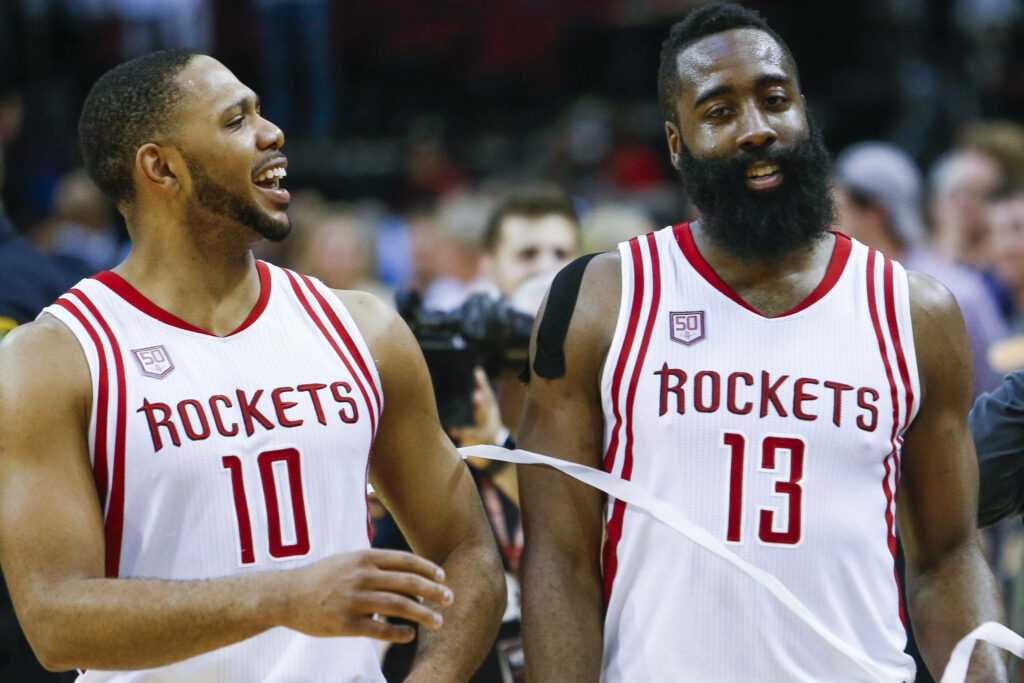 Eric Gordon and James Harden in Houston Rockets jerseys sharing a moment on the basketball court Wallpaper