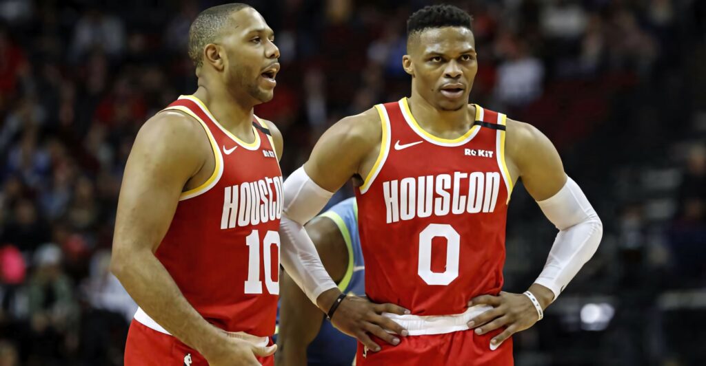 Eric Gordon and Russell Westbrook in Houston Rockets jerseys focus during intense NBA game on court Wallpaper