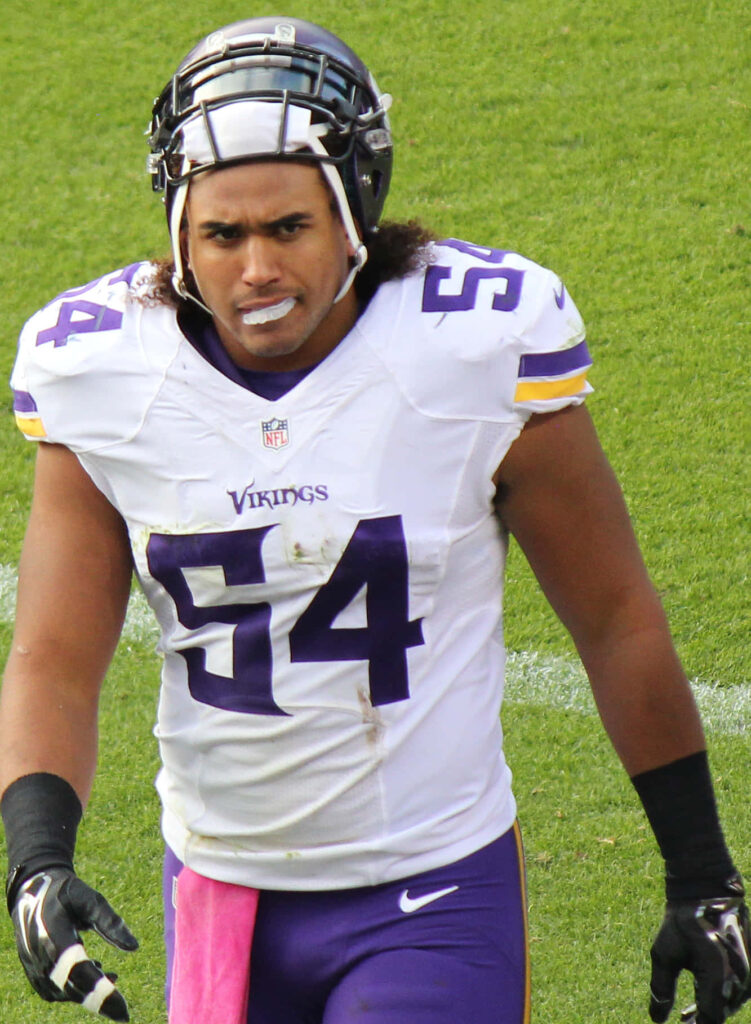 Eric Kendricks Minnesota Vikings number 54 intense focused linebacker on vibrant green football field wallpaper