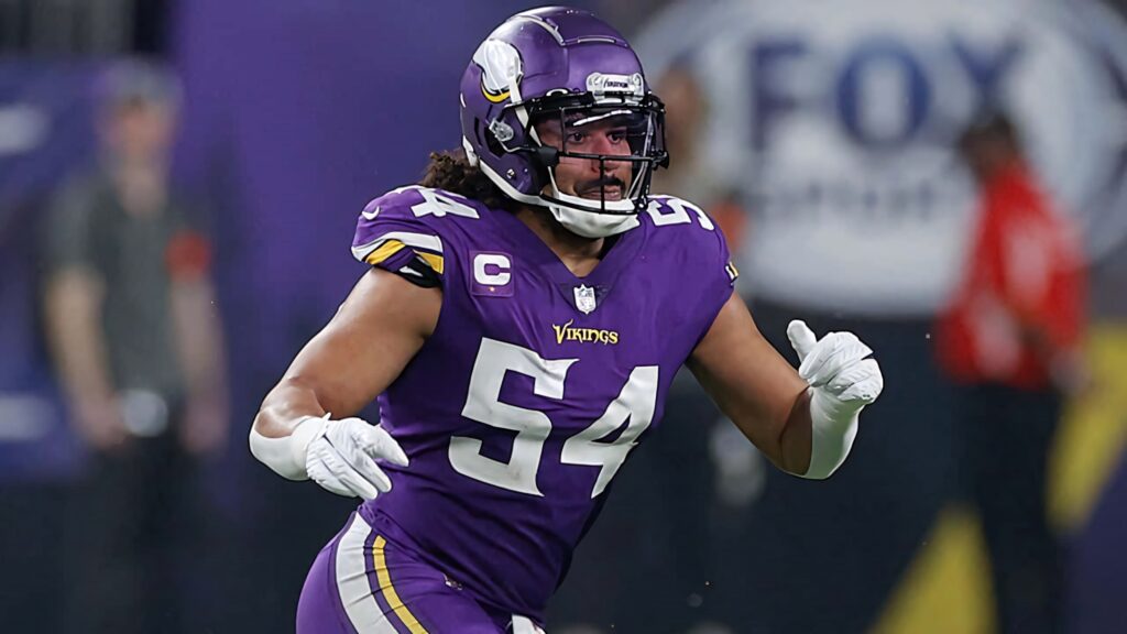 Eric Kendricks in purple Vikings uniform showing intense focus in dynamic football action shot Wallpaper