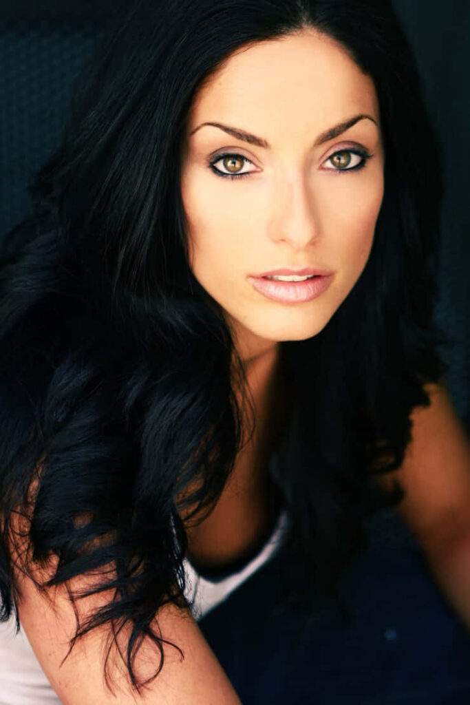 Erica Cerra close-up portrait with green eyes long dark hair natural makeup soft lighting wallpaper