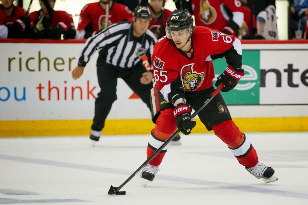 Erik Karlsson Ottawa Senators action shot intense focus NHL hockey vivid team colors wallpaper
