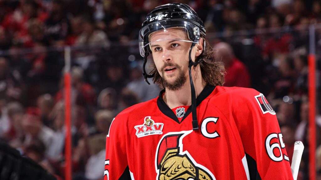 Erik Karlsson Ottawa Senators captain in red black white NHL uniform on ice detailed wallpaper