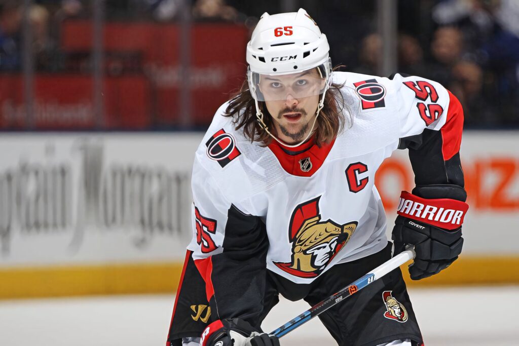 Erik Karlsson Ottawa Senators captain in red black jersey intense hockey action wallpaper