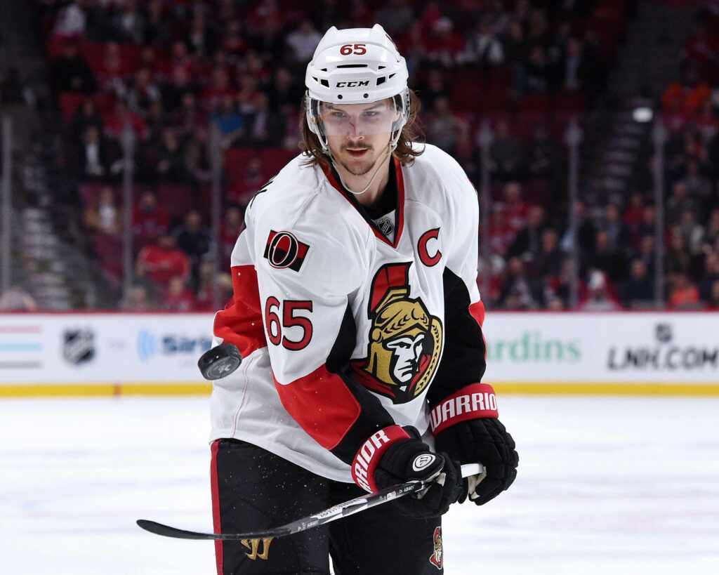 Erik Karlsson Ottawa Senators captain in number 65 jersey focused on ice hockey action Wallpaper