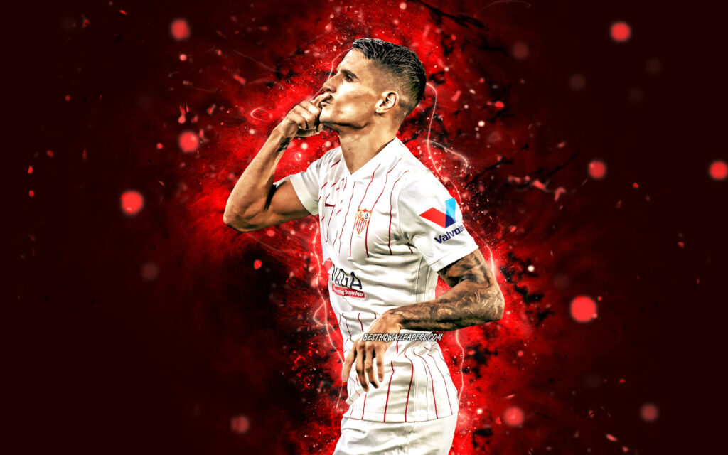 Érik Lamela Sevilla FC celebrating digital art wallpaper with dynamic red black background lighting effects