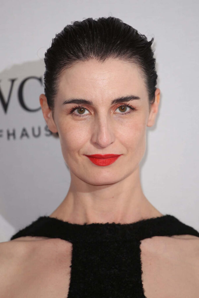 Erin OConnor minimalist portrait wallpaper monochrome background sharp features red lips elegance