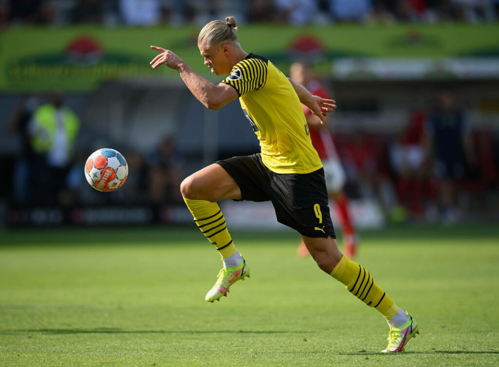 Erling Haaland in Action: Skillful Ball Control Football Wallpaper