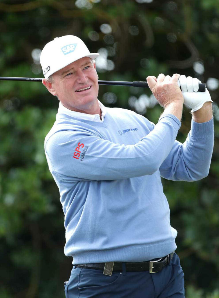 Ernie Els mid-swing golf wallpaper showing smooth technique and focus on lush green course