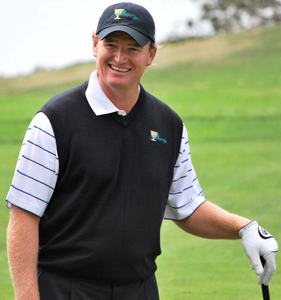 Ernie Els golfing on green course wearing classic attire cap and glove sports elegance wallpaper