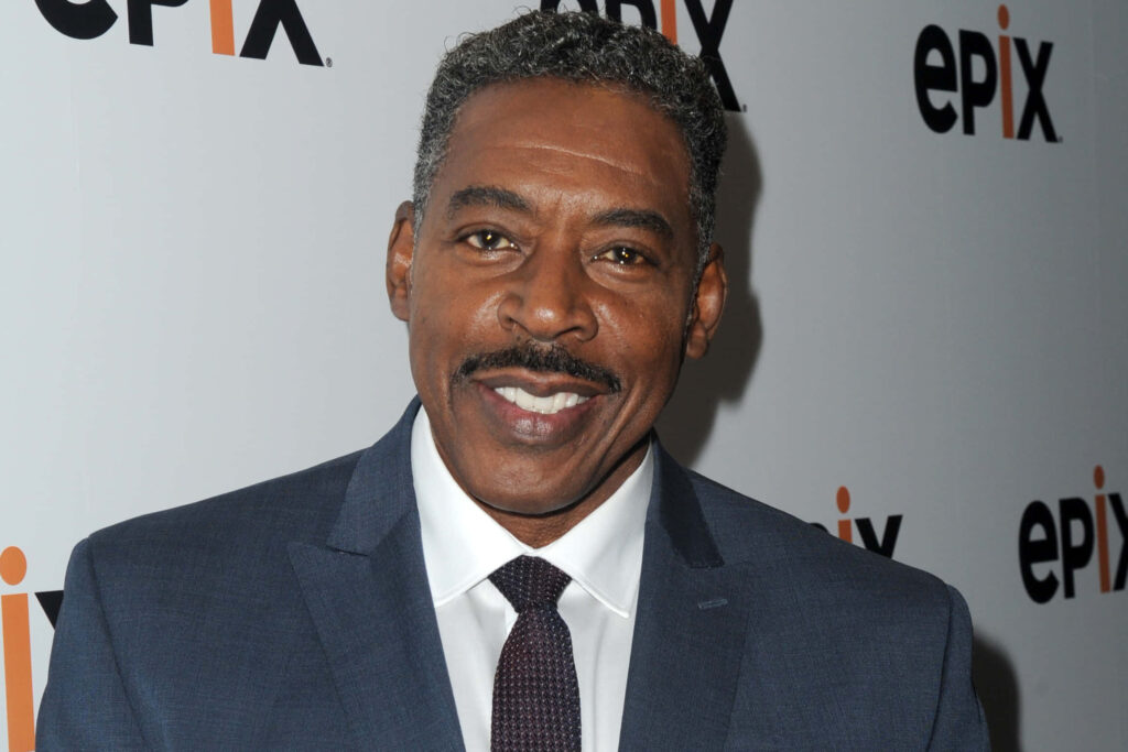 Ernie Hudson in sharp blue suit smiling at EPIX event with professional charismatic backdrop wallpaper