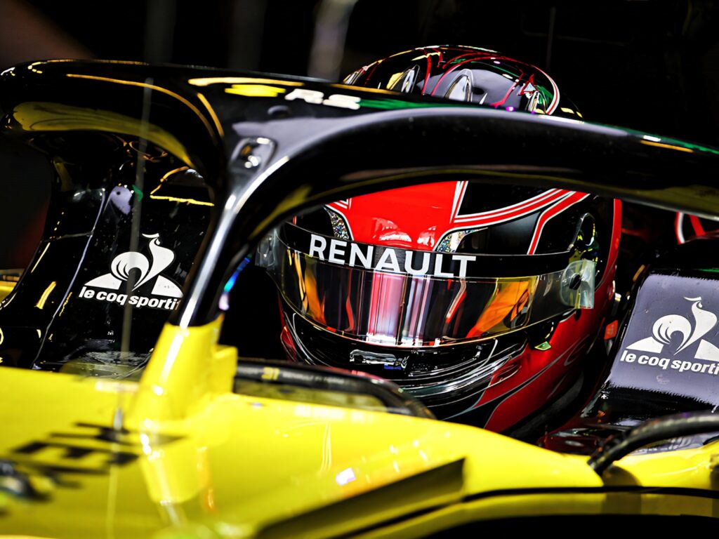 Esteban Ocon in Renault F1 helmet cockpit yellow black car motorsport precision wallpaper
