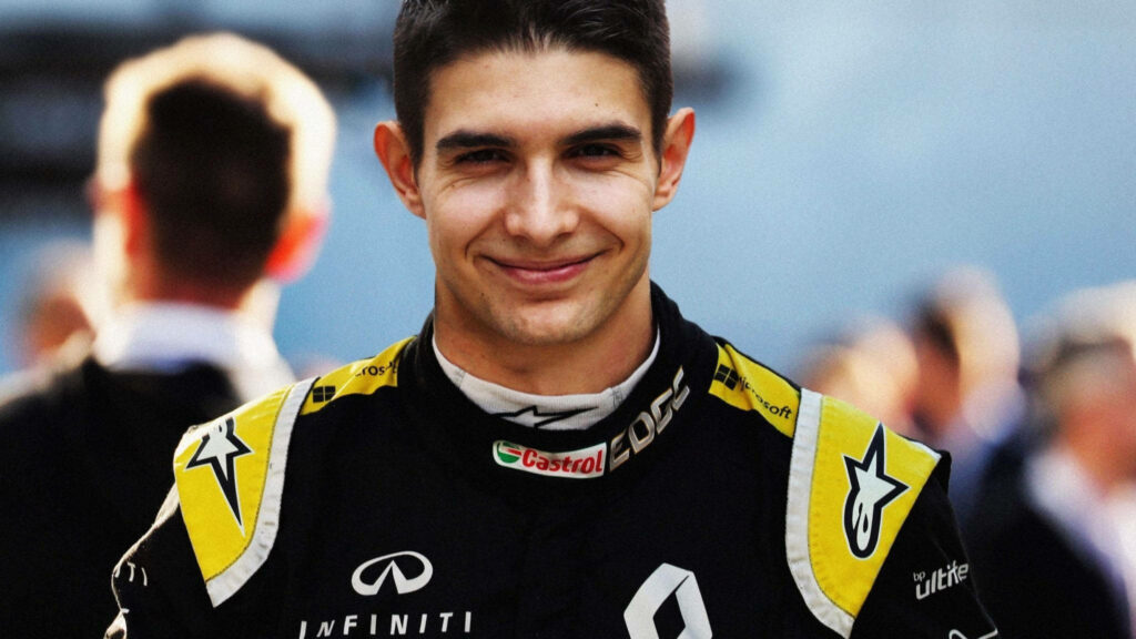 Esteban Ocon in Renault Formula 1 suit with detailed logos in natural light wallpaper background