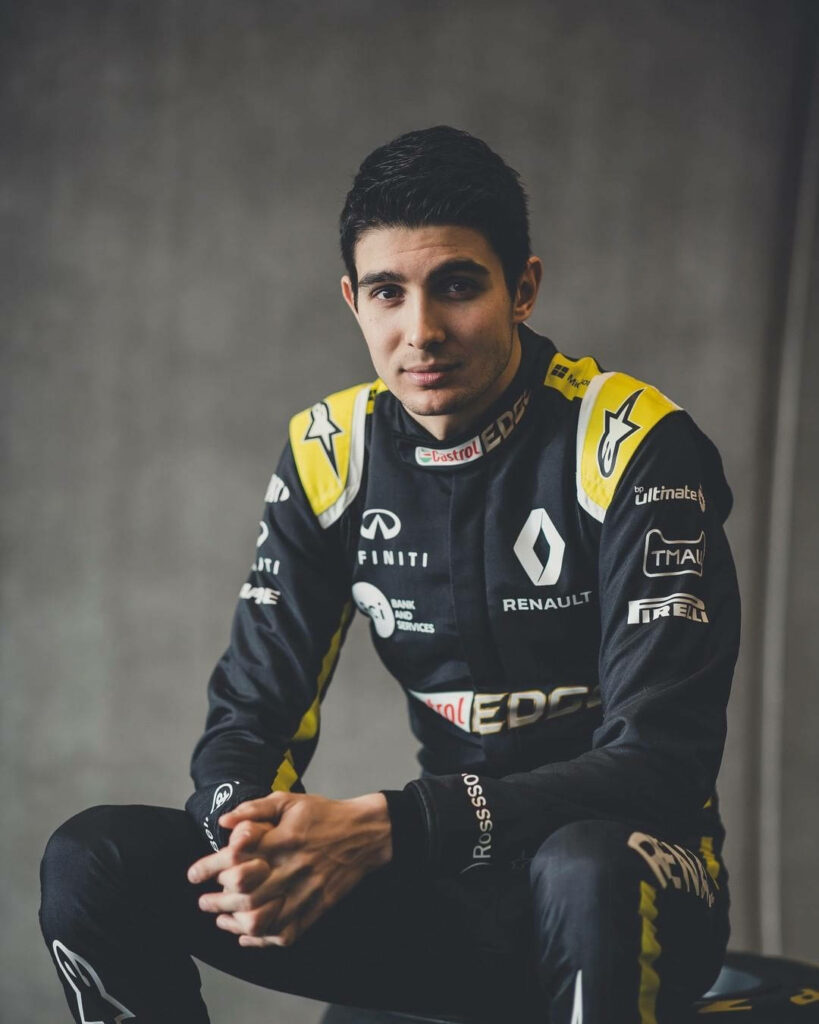 Esteban Ocon in Renault racing suit black and yellow modern professional Formula 1 portrait Wallpaper