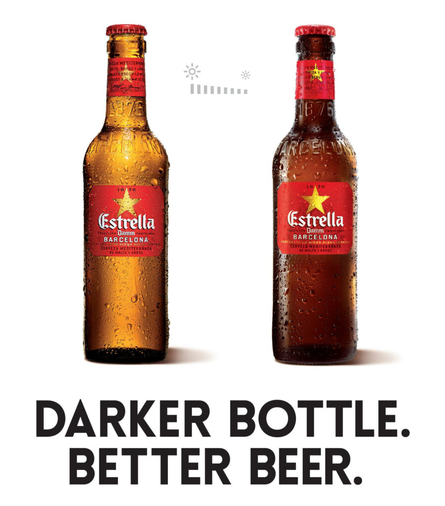 Estrella Damm wallpaper with light and dark beer bottles and Darker Bottle Better Beer text