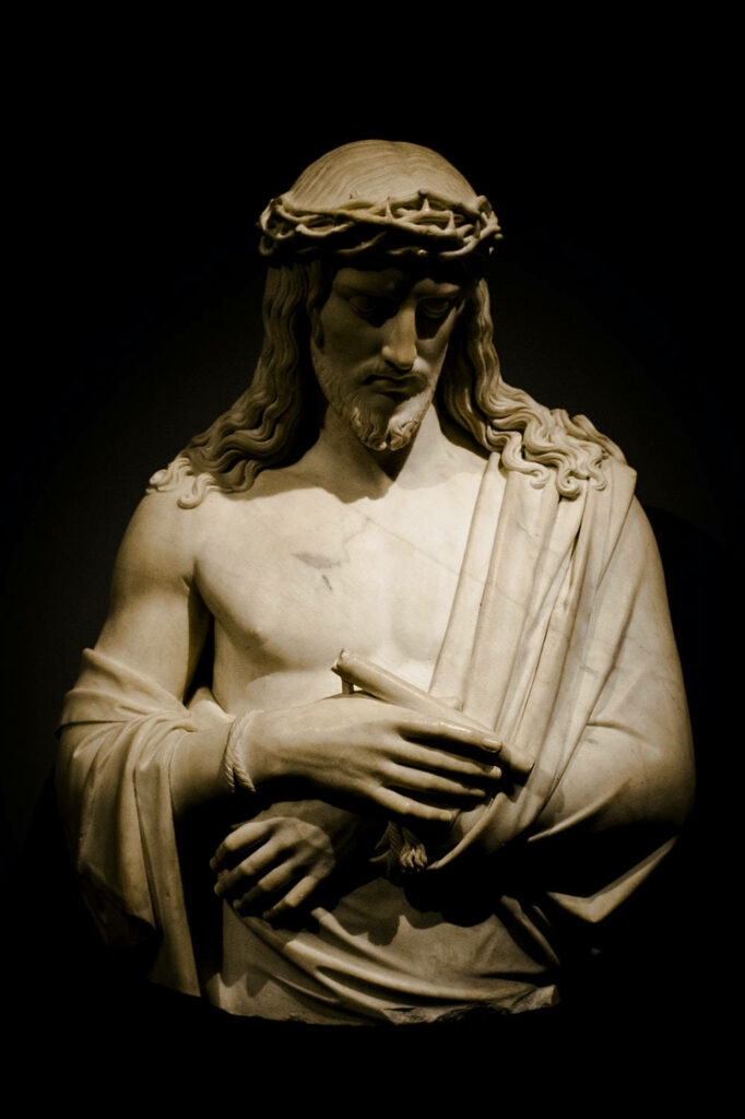 Divine Contemplation: Captivating God-themed Laptop Background featuring Jesus Christ Statue Wallpaper